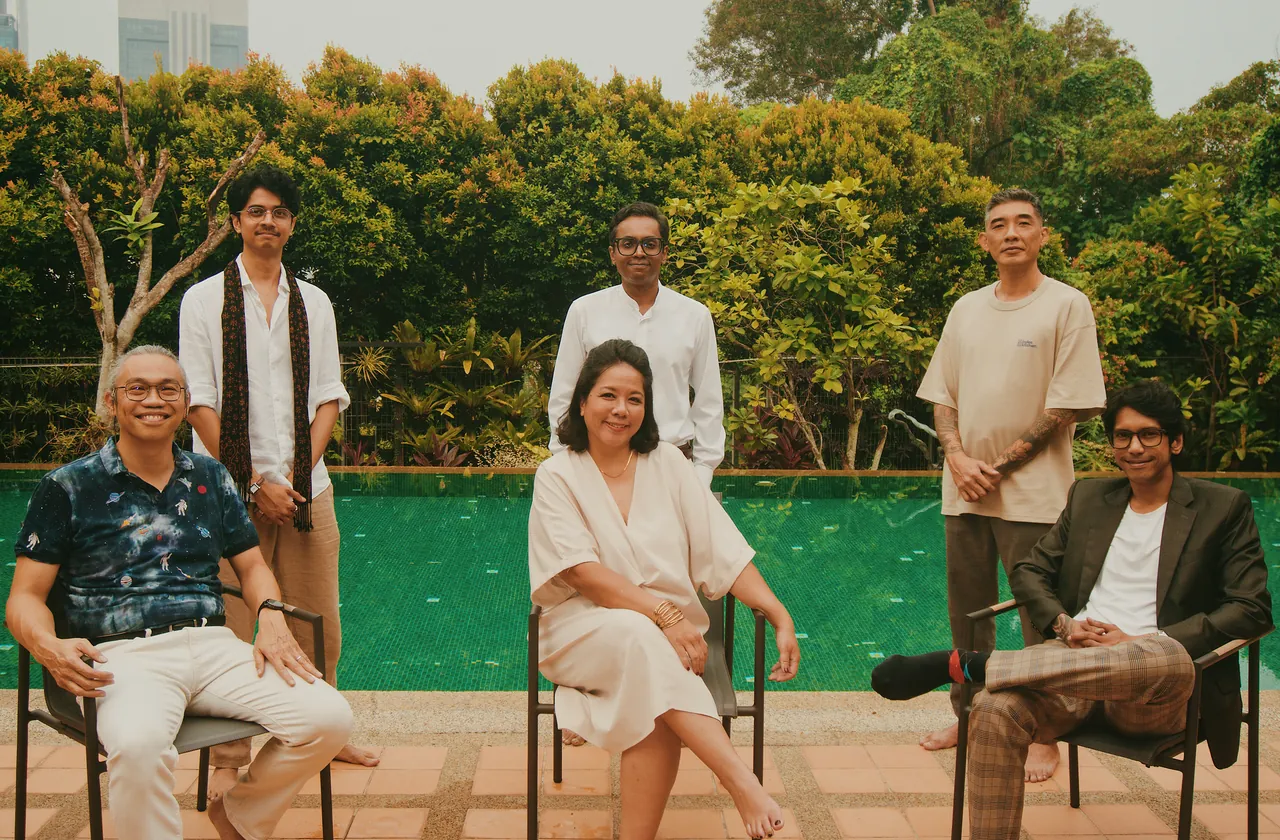 The founding members of ALIM beside the pool, three seated and three standing.